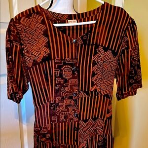 NWOT. Never worn, this beautifully printed dress is made in Bali.